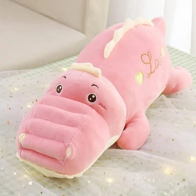 Gentille peluche dinosaure rose remplie de tendresse