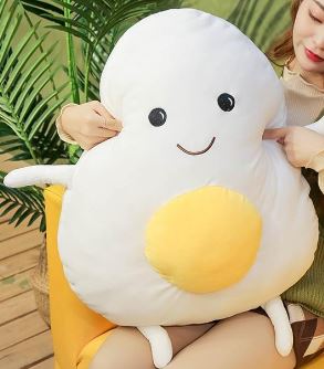 Peluche géante souriante en forme de crane d’œuf