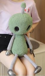 Jouet en peluche extraterrestre aux grands yeux