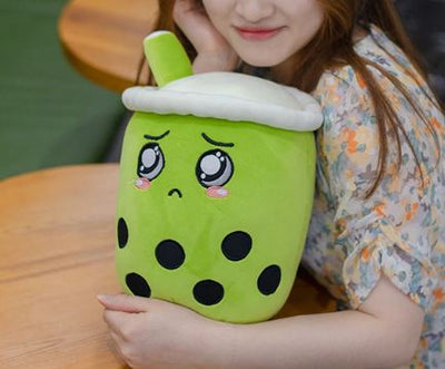 Jouet en peluche en forme de tasse aux yeux brillants