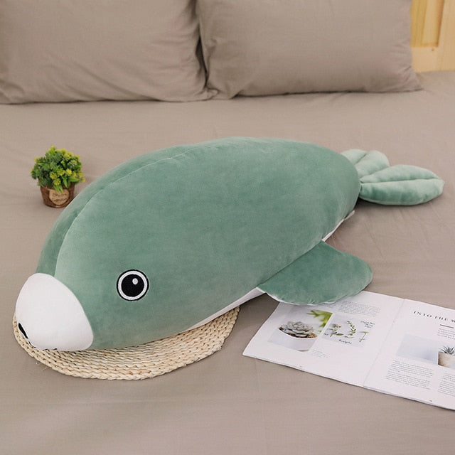 Peluche verte aux grands yeux en forme de phoque