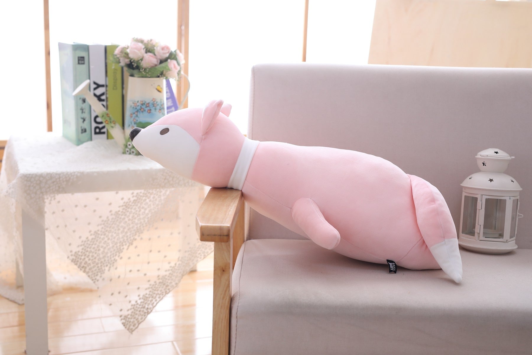 Grosse peluche rose pleine de tendresse renard