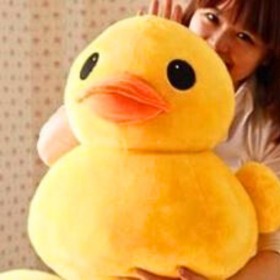 Gros canard en peluche coin coin aux grands yeux